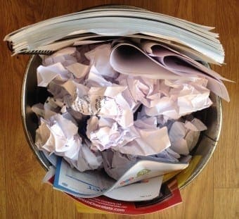 Bin with paper and presentation slides