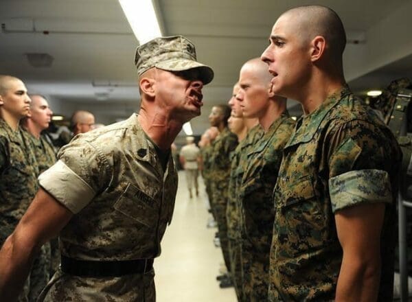 Drill sergeant yelling at cadet Drill instructor yelling at cadet in the army is Authoritarian Leadership