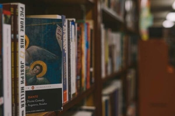 The Divine Comedy book on a bookshelf in a library 