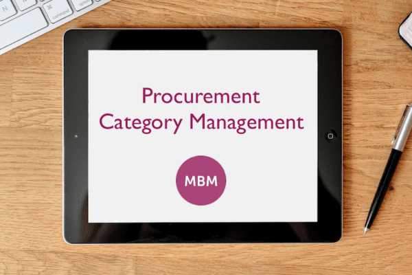 Digital tablet on desk with Procurement Category Management and purple MBM logo on the screen