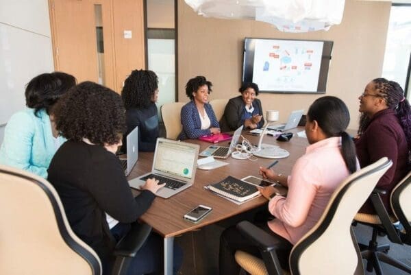 Women in a meeting are happy and positively engaging with their work