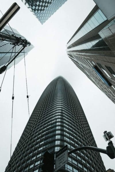 Worms eye view of tall glass buildings