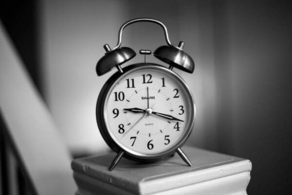 Black and white picture of a vintage alarm clock represents the right timing for creating learning content