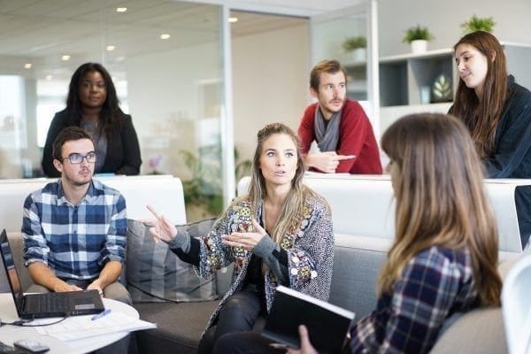 Group of colleagues in an informal meeting learning about personality tests