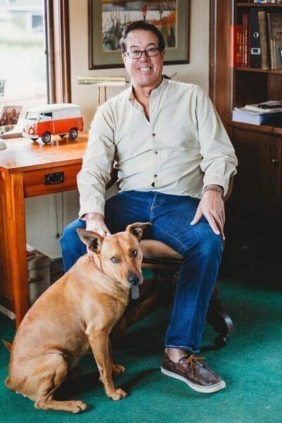 George Troy Midshot of George Troy with his dog next to him