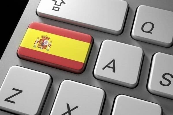 Close up of keyboard with a Spanish flag key replacing the shift key 