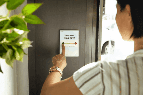 Female businesswoman pointing to a chart to measure how good her day was