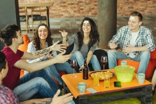 Work colleagues playing games at a social gathering