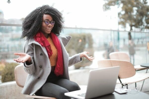 Woman practicing communication in front of her laptop