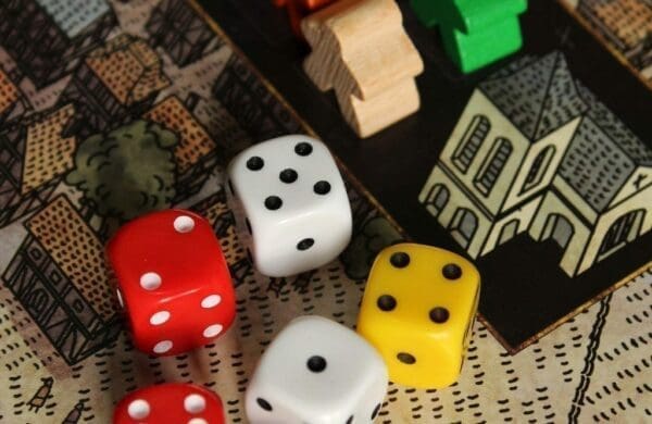 Colored dice on a boardgame for team-building activity