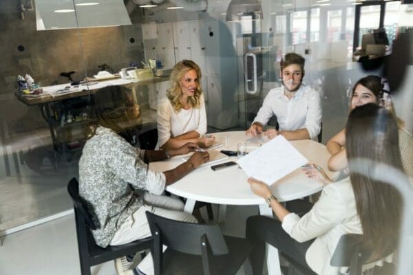 Coworkers in a weekly meeting