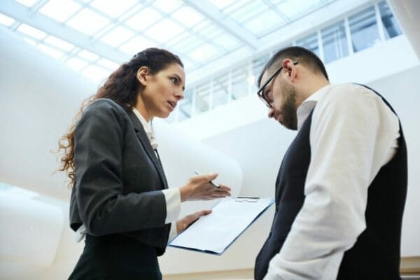 Businesswoman having a difficult conversation with a businessman is standing her ground