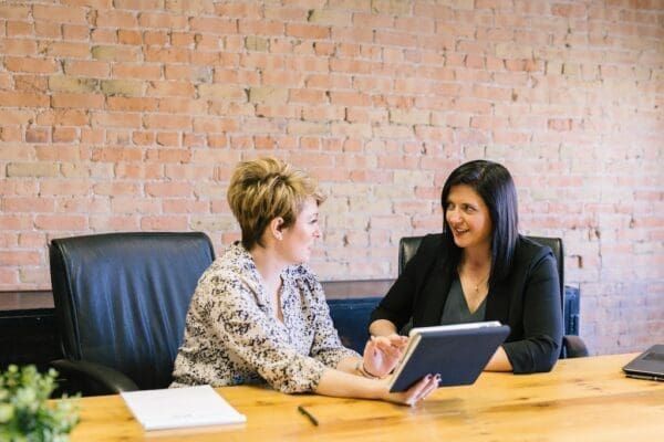 One female coworker is helping another female coworker shows moral