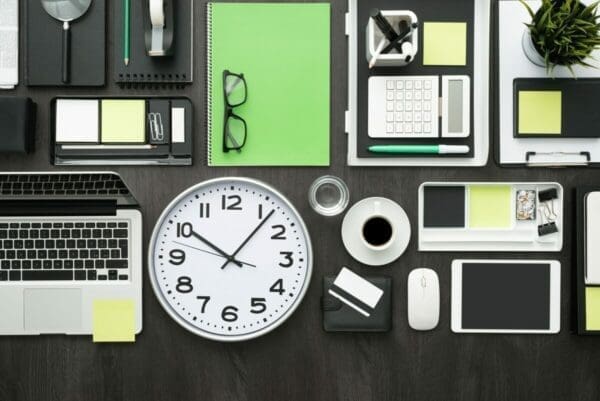 Office and work tools laid out very neatly on a desk