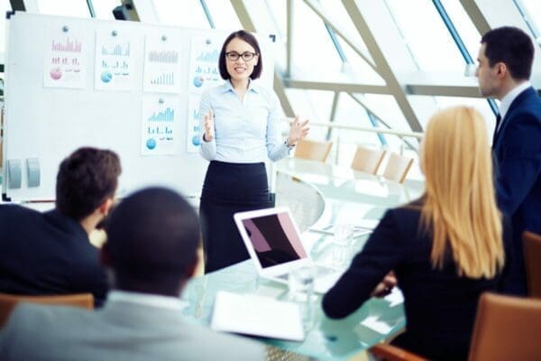 Businesswoman presenting in front of colleagues 