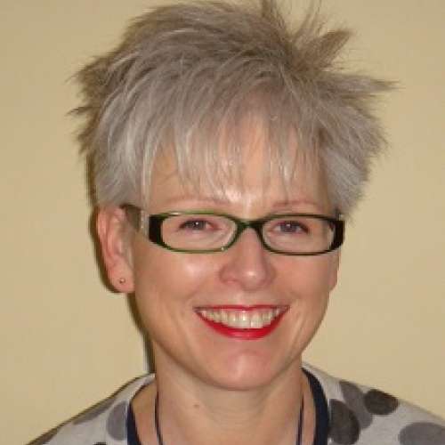 Headshot of Jackie Lanham smiling at camera