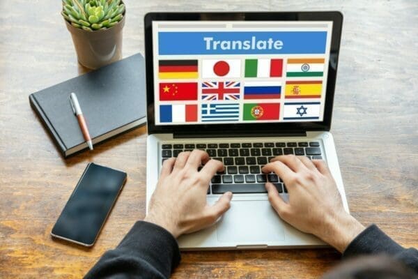 Laptop displaying translation tool to help with the cross-cultural communication barrier