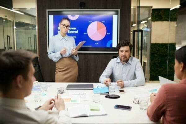 Businesswoman giving a presentation to a group of colleagues