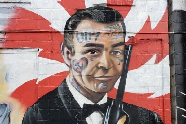 Graffiti of James Bond character on a wall