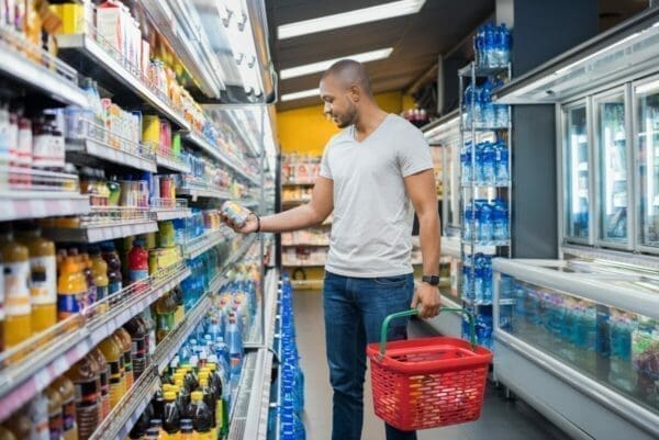 Man browsing supermarket shelf