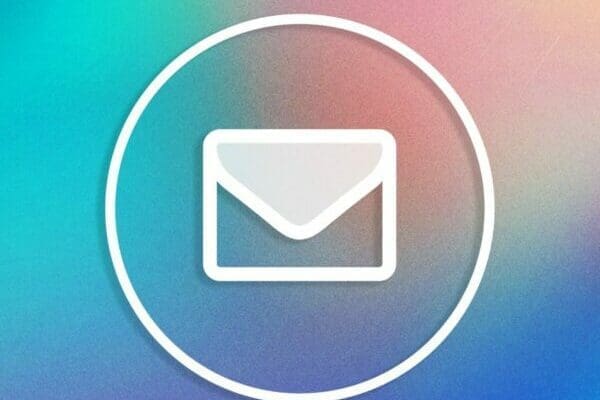 White email icon on a colourful blue green pink gradient background