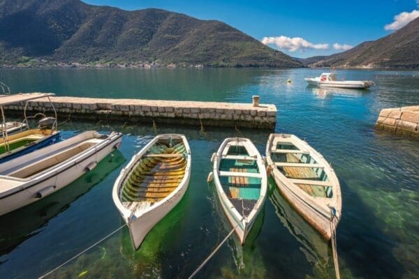 Three small fishing boats at a dock