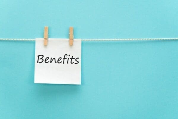 Benefits written on note pinned to a line