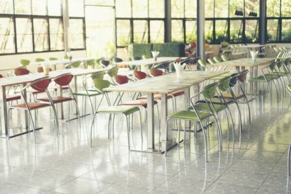 Empty canteen with tables and chairs