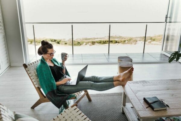 Woman working from home with feet on table