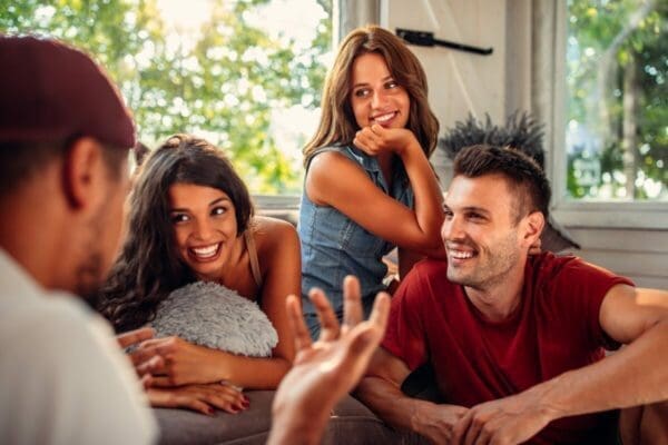 A man telling a story to a group of friends