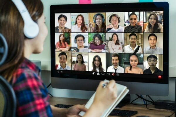 Female employee doing a virtual induction on her computer