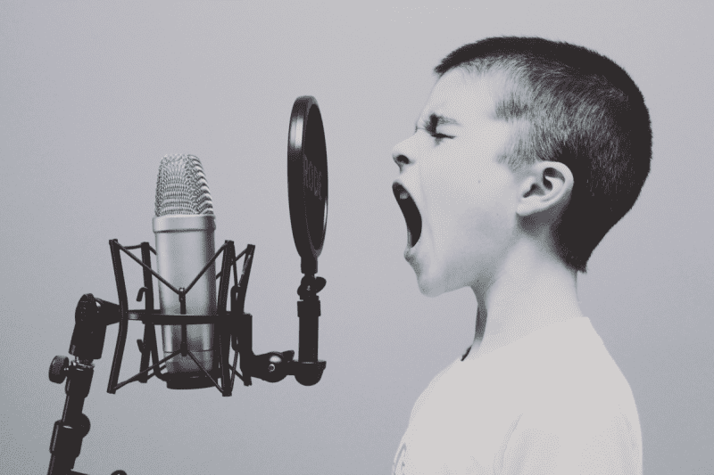 Person shouting into a microphone