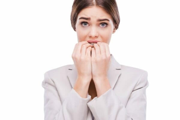 Nervous businesswoman biting her nails