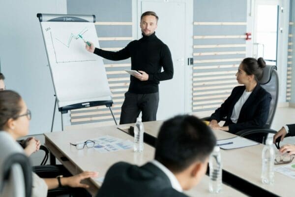 Businessman doing an excellent presentation to employees