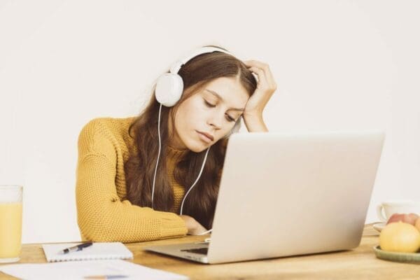 Young girl fell asleep in front of laptop whilst on a meeting