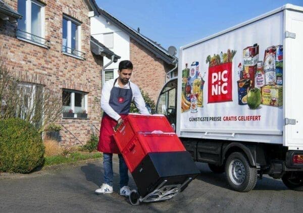 Picnic delivery driver unloading the delivery from a van