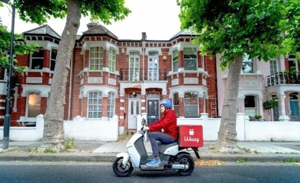 Delivery driver on a Weezy delivery scooter