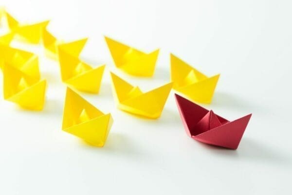 Leader red boat leading follower yellow boats