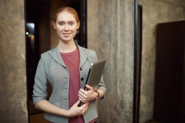 Line manager with laptop computer in business attire