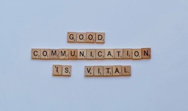 Good communication is vital spelled out in wooden tiles