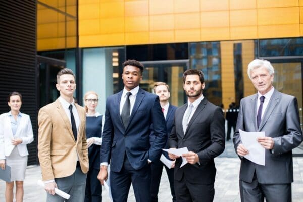 young entrepreneurs standing outside of office buildings