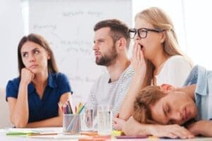 Bored colleagues during a boring presentation