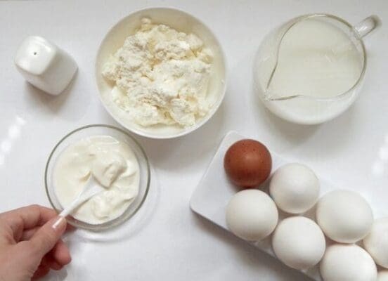 Cake ingredients laid out on a white surface