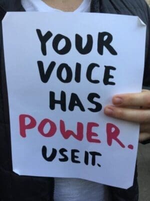 Your voice has power use it quote on handwritten paper sign
