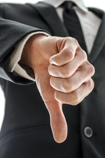 Business man showing thumb down