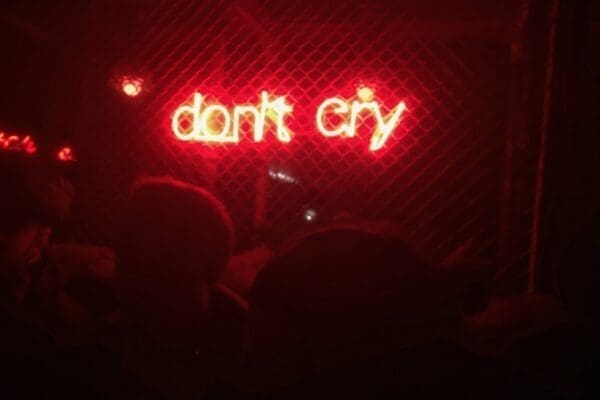 Don't cry red neon lit up sign