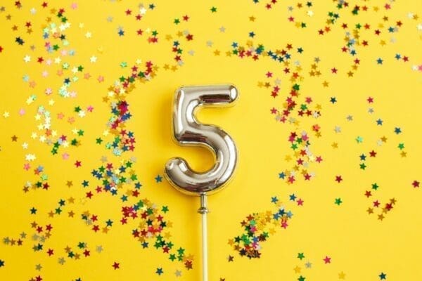  number five with multicolored star confetti