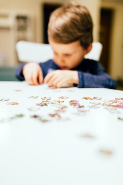 Jigsaw puzzle 2 year old child solving jigsaw puzzle