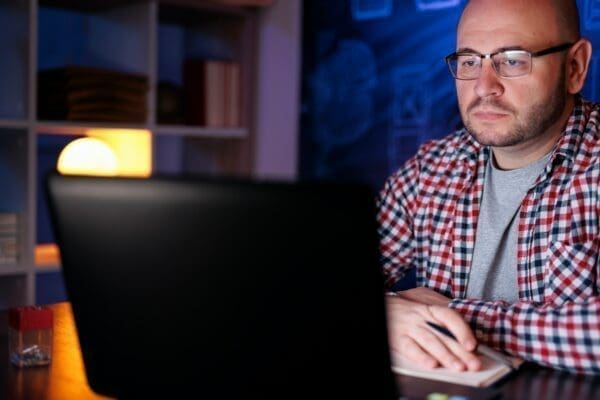 Businessman taking an online course at night