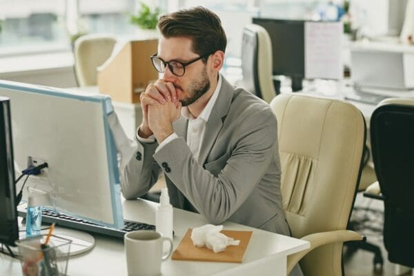 Nervous man in empty office calming his nerves before a presentation